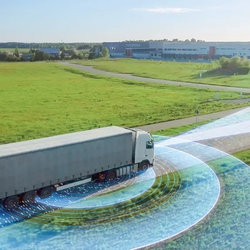 A truck equipped with environmental sensors and driv-ing in open country.